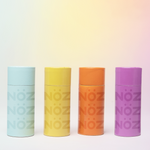Load image into Gallery viewer, Nöz face sunscreen in blue, yellow, orange, and purple colors
